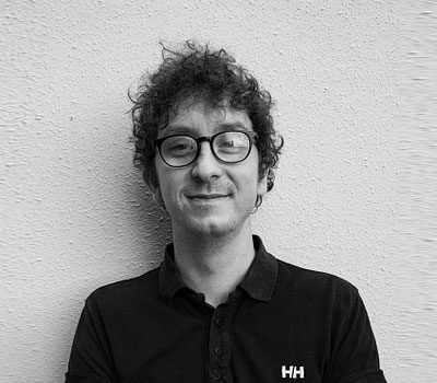 a black-and-white portrait of a male wearing glasses