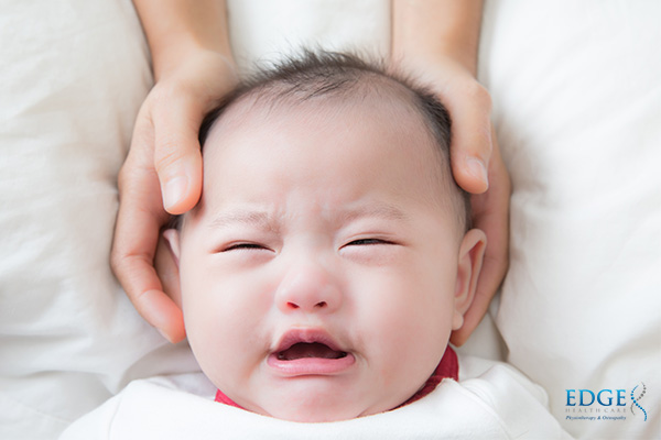 baby getting a treatment in osteopathy singapore